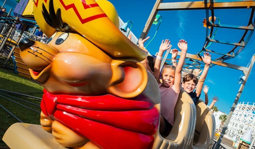 The six children enjoy riding in Kiddie Rides at Family Kingdom Amusement Park