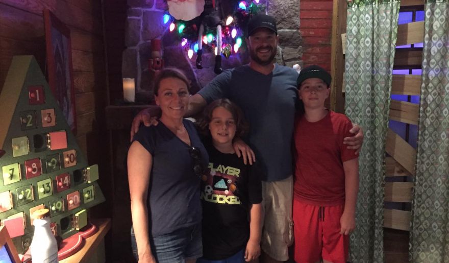 The family of tourist taking a picture inside the Backstage Escape Room