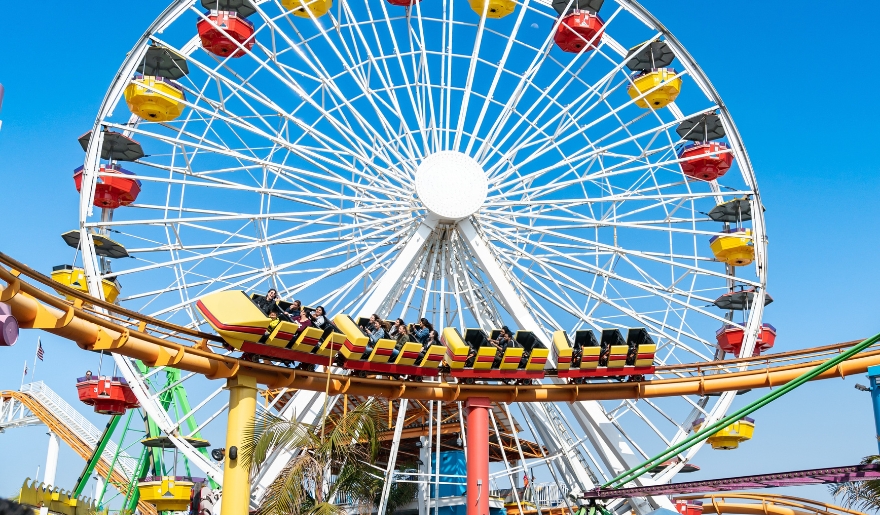A large amusement ride featuring a colorful Ferris wheel and a twisting roller coaster at Pavilion Park, Myrtle Beach.