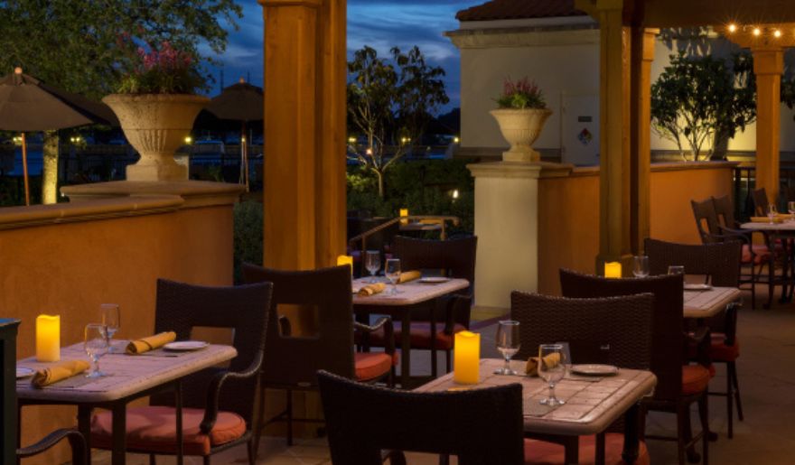 Elegant outdoor dining area lit by candlelight, perfect for a romantic evening in Myrtle Beach.