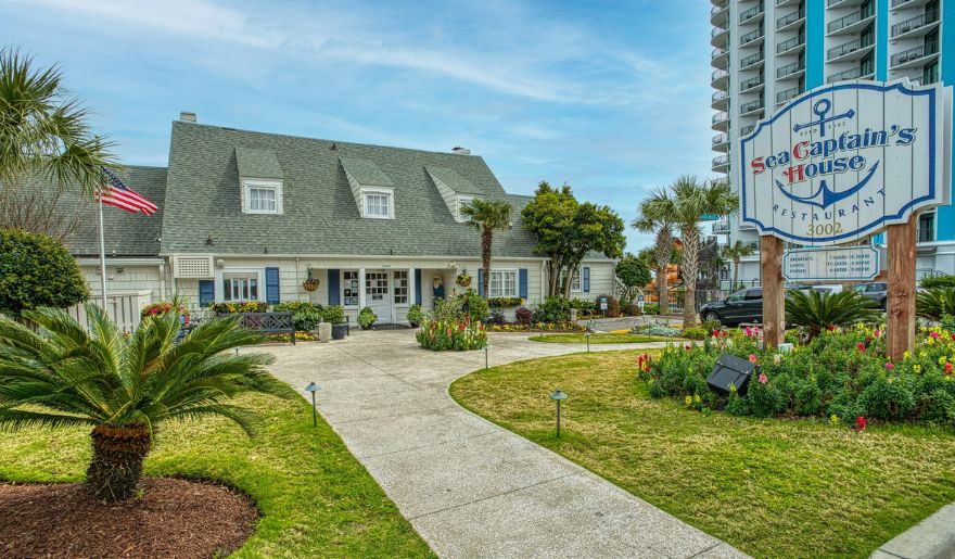 The charming exterior of Sea Captain's House, a historic dining spot for a cozy Myrtle Beach romantic getaway.