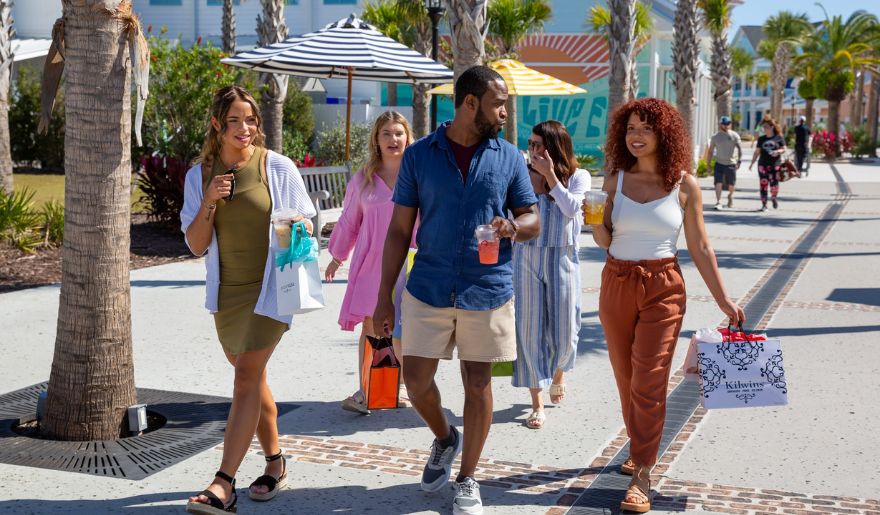 A group of tourists enjoy black friday shopping at Broadway at the Beach