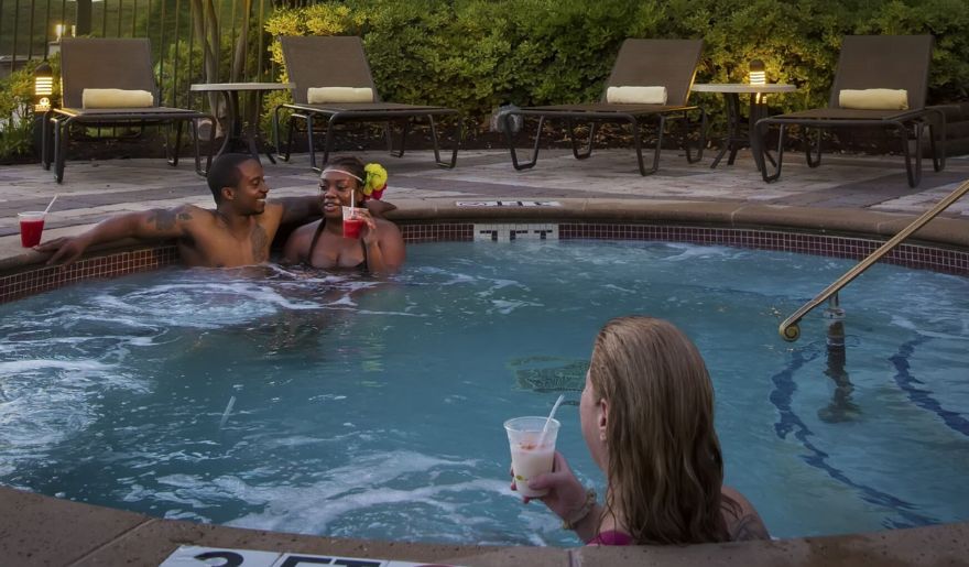 A group of tourist enjoys the hot tub at Marina Inn, showcasing one of the best things to do in Myrtle Beach in October