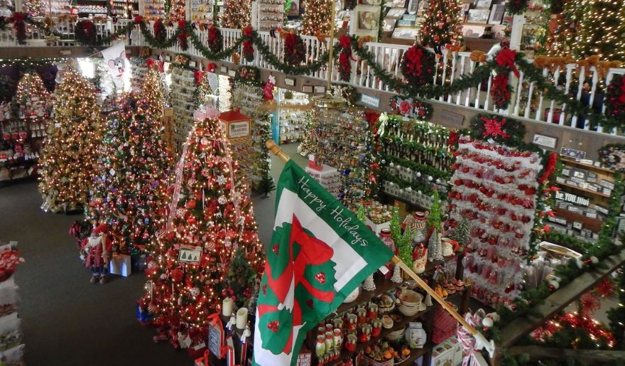 A spacious retail store adorned with Christmas trees and decorations, highlighting the festive spirit of Myrtle Beach Christmas.