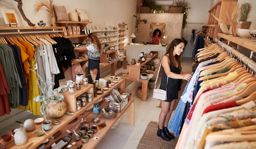 A woman looks at various clothing items in Hudson’s Surfside Flea Market, located in Myrtle Beach.
