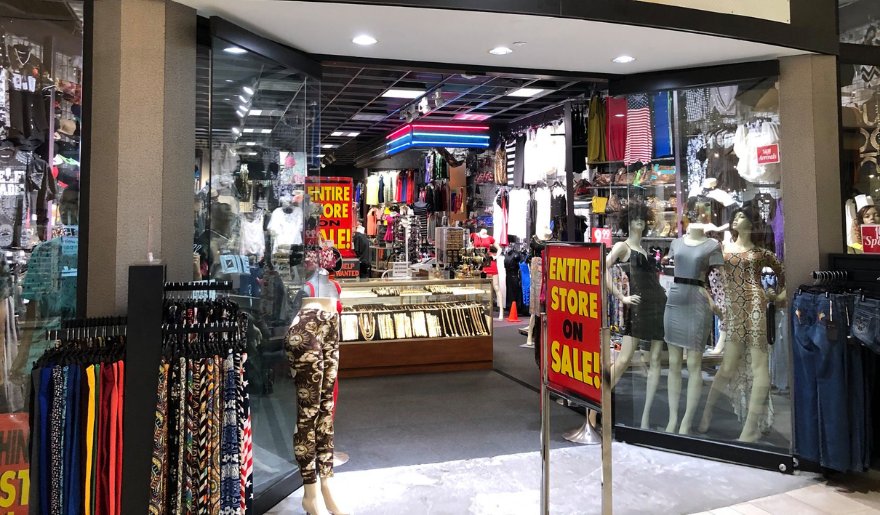  A well-organized store filled with stylish clothes and accessories, highlighting the shopping experience at Myrtle Beach Mall.