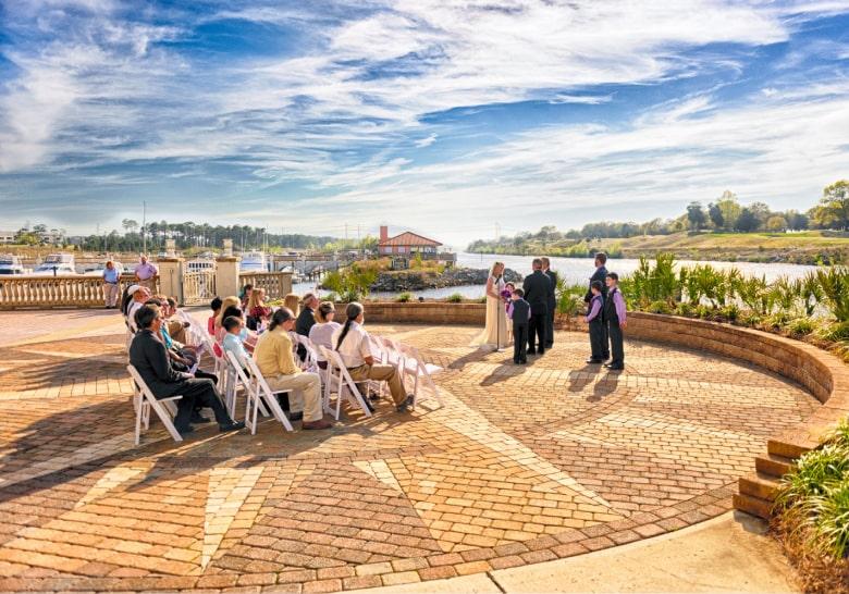 Outdoor waterfront wedding ceremony at Marina Inn Grande Dunes in Myrtle Beach