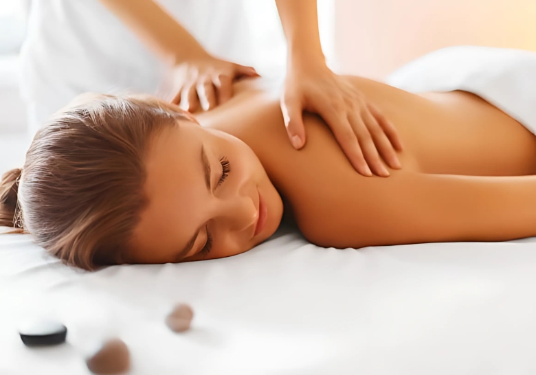 A woman enjoys a relaxing back massage at an affordable family resort spa in Myrtle Beach.