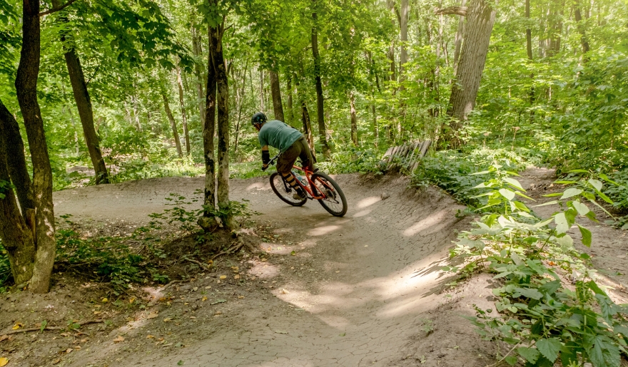 A cyclist navigating through the wooded paths of Myrtle Beach Bike Trails, referred to as The Hulk.