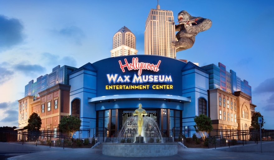 Exterior view of the Hollywood Wax Museum in Myrtle Beach, showcasing life-sized wax figures of celebrities and attractions.