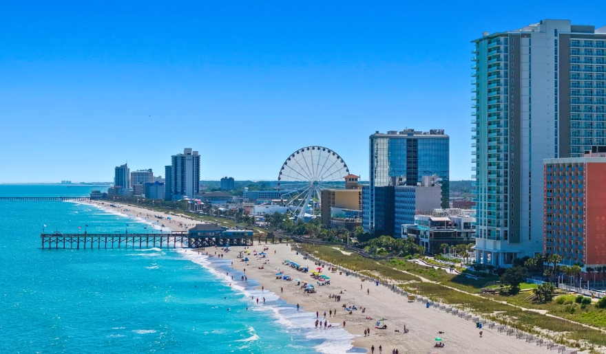 Scenic view of Myrtle Beach, SC, showcasing the sandy beach and ocean, perfect for family activities and relaxation.