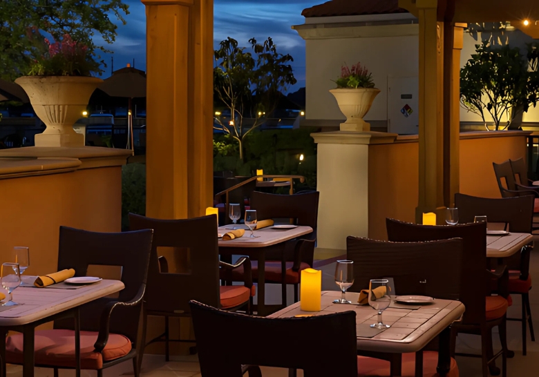 A cozy restaurant at Myrtle Beach SC featuring waterfront dining with tables and chairs set for guests.