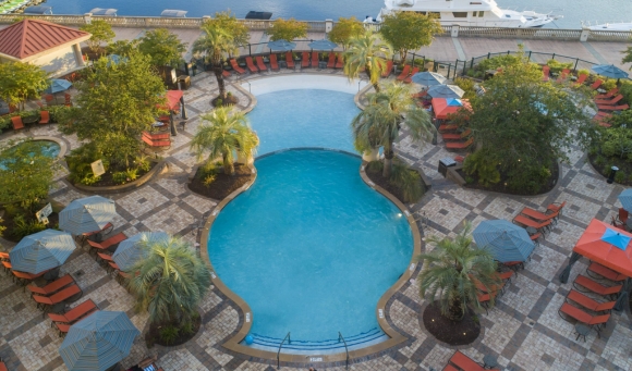 The inviting pool area at the Marina Inn, featuring clear water and comfortable seating for relaxation.