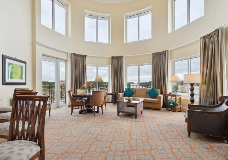 A luxurious living room in a family suite at Myrtle Beach Family Resort, featuring elegant furnishings and spacious design.