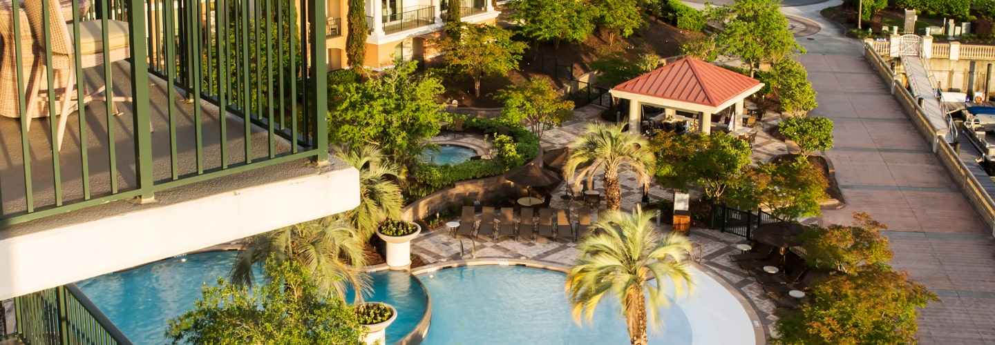 The inviting pool at the Marina Inn at Grande Dunes, complete with sun loungers and tropical landscaping for a serene escape.