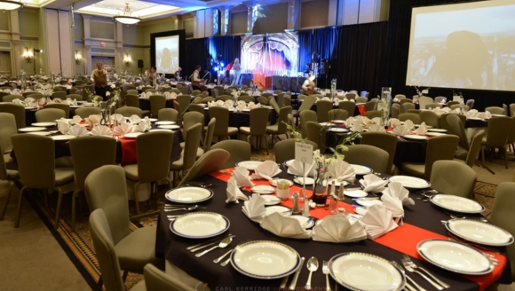 A spacious banquet room set for a private Easter brunch event in Myrtle Beach, featuring elegantly arranged tables and chairs.