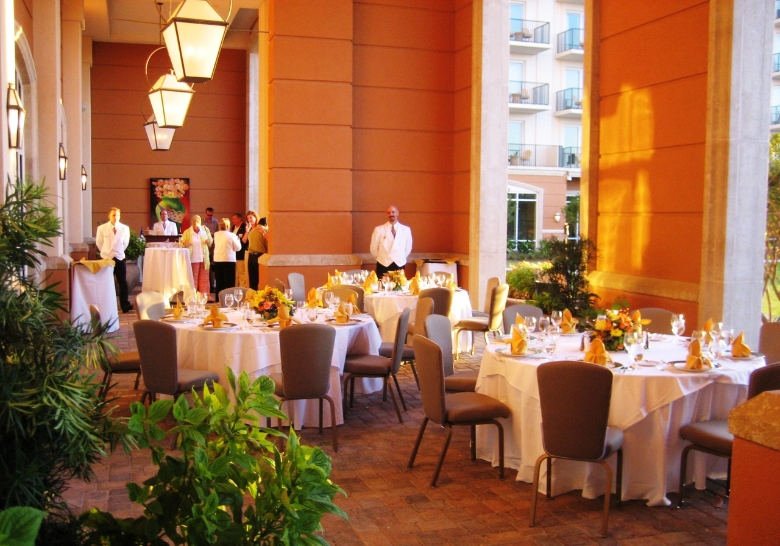 A spacious outdoor dining area featuring tables and chairs, set for the Myrtle Beach Easter Brunch with exceptional hospitality.