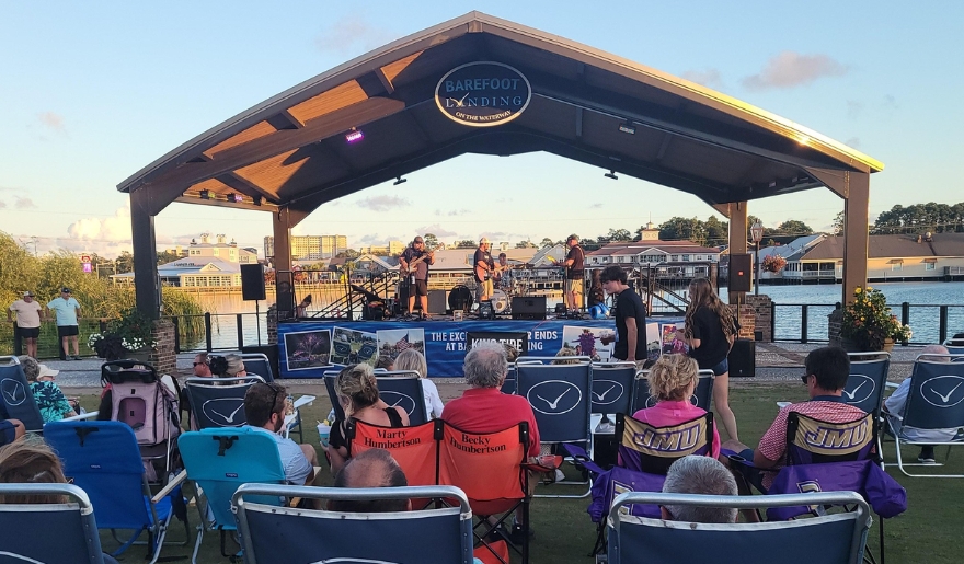 A group of attendees relaxes in lawn chairs at a concert during Barefoot Landing's Spring Live Music in Myrtle Beach.