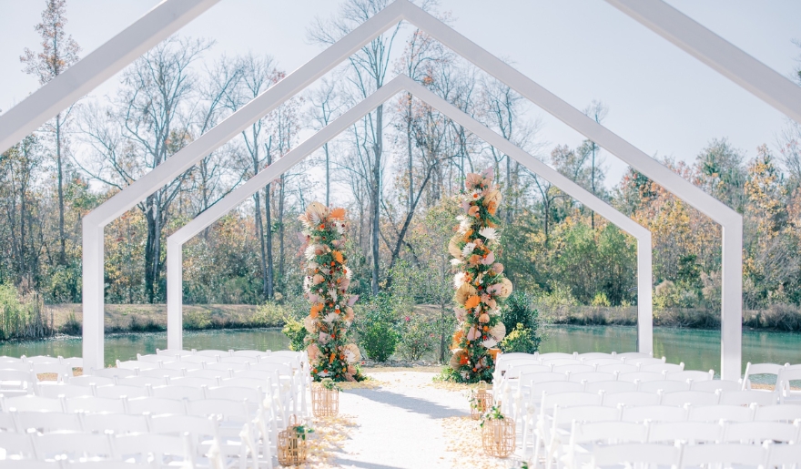 A romantic wedding ceremony takes place by the tranquil lake, part of the Grand Strand Bridal Expo at Myrtle Beach Events.