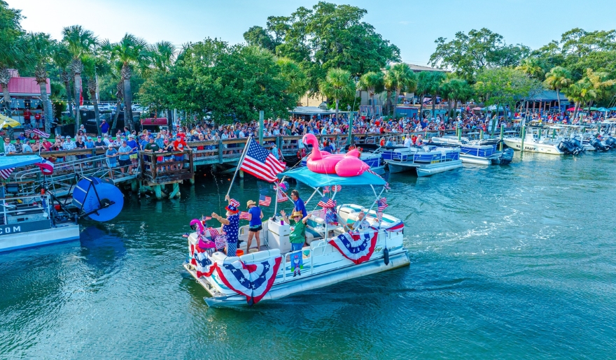 Participants enjoy a boat ride in the water at the Murrells Inlet Boat Parade, part of Myrtle Beach Events in 2025.
