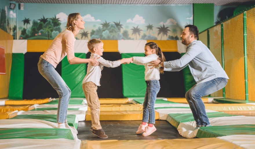 Joyful family enjoying trampoline fun at Big Air Trampoline Park, Myrtle Beach, creating lasting vacation memories.