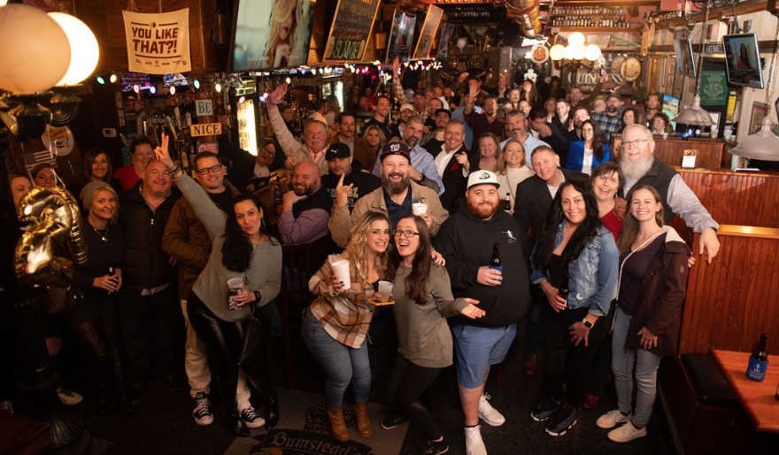 Friends gather for a cheerful photo at Bumstead’s Pub, showcasing the vibrant nightlife of Myrtle Beach.