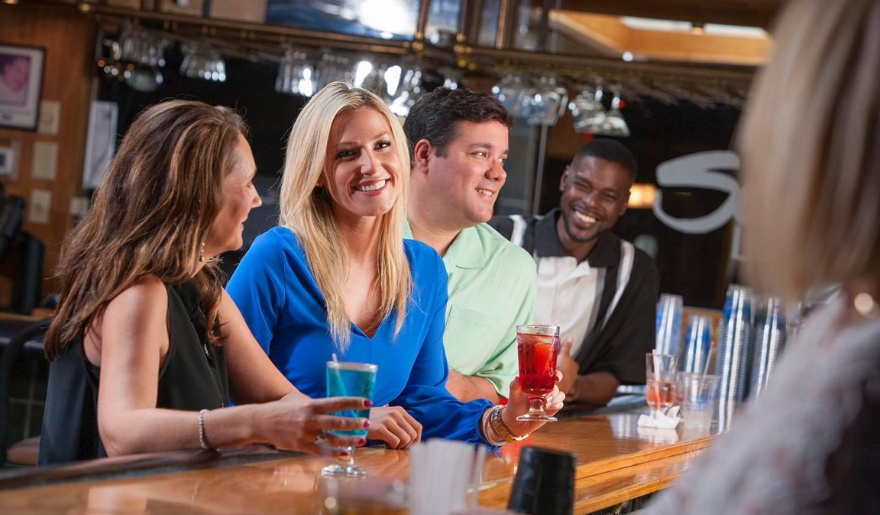 A lively group enjoying drinks at Ocean Annie's Beach Bar in Myrtle Beach, capturing the essence of nightlife.