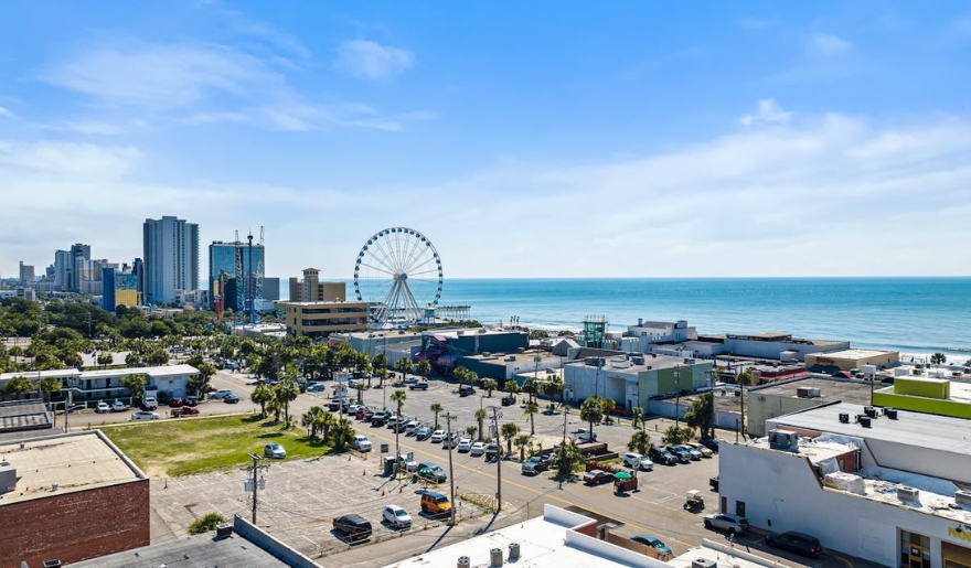 Overlooking the ocean and ferris wheel from a high-rise in Myrtle Beach, capturing the essence of May's delightful weather.