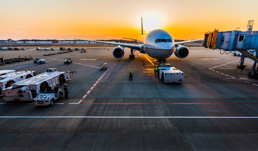 An airplane parked on the tarmac at an airport, featured in the Myrtle Beach Travel Guide.