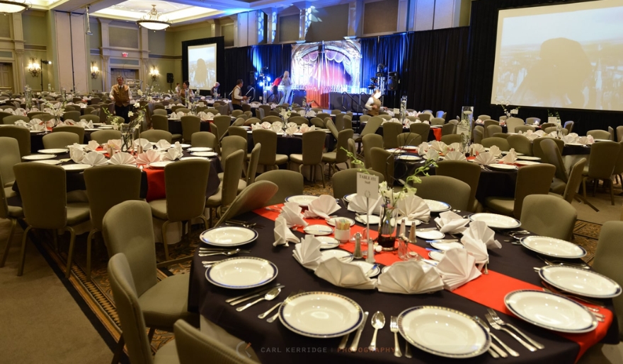 A spacious banquet room set up with tables and chairs, ideal for corporate events in Marina Inn at Myrtle Beach.