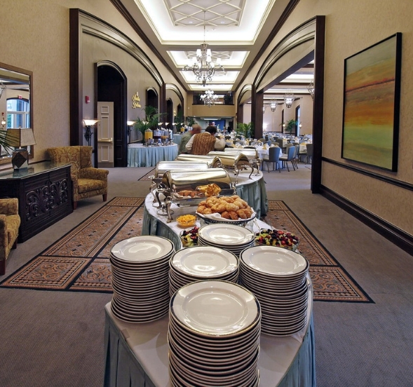 A long hallway featuring a buffet table and chairs, set up for birthday parties in Myrtle Beach, SC.