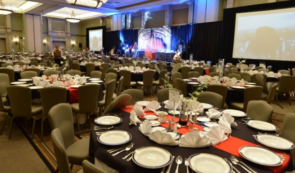A decorated banquet hall in Myrtle Beach, SC, featuring tables and chairs arranged for a birthday party dinner.
