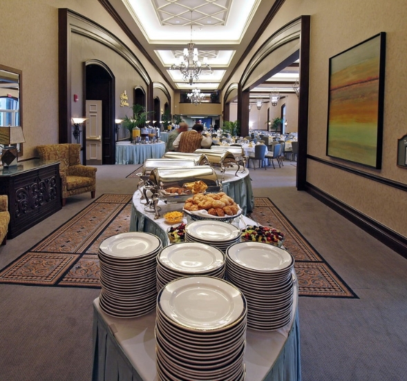 A well-arranged buffet table with numerous plates of food, representing catering services in North Myrtle Beach, SC.