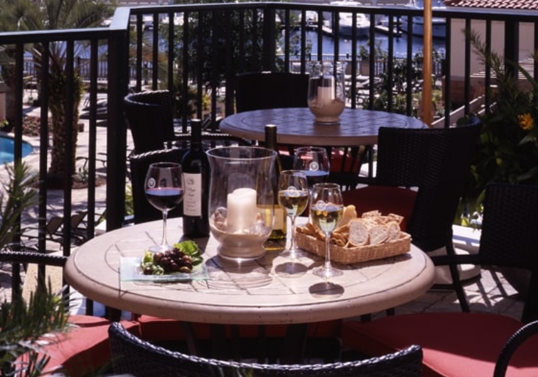 A table featuring wine glasses and a bottle of wine, highlighting catering services for a continental breakfast in North Myrtle Beach, SC.