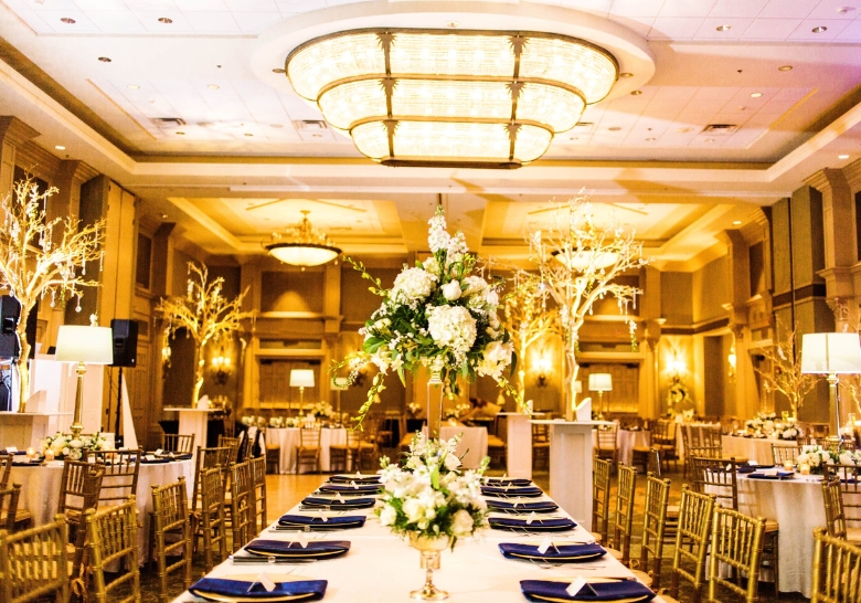 A wedding reception adorned with blue and gold decor, highlighting passed hors d'oeuvres in North Myrtle Beach, SC.