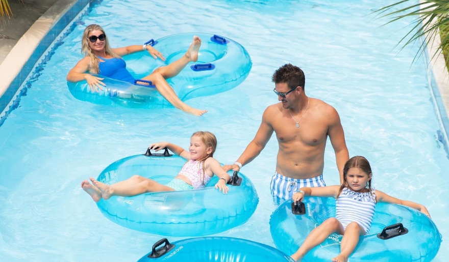 A family enjoys splashing in the indoor pool at Myrtle Waves Waterpark in Myrtle Beach during August.