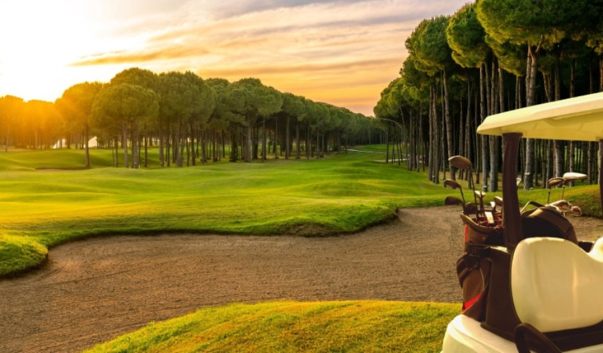 Sunset over a Grande Dunes Resort Course, showcasing vibrant colors and serene landscapes in June.