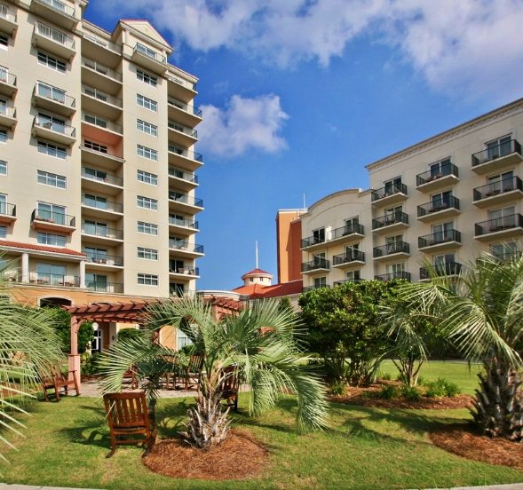 Luxury resort buildings and garden courtyard at Myrtle Beach honeymoon destination