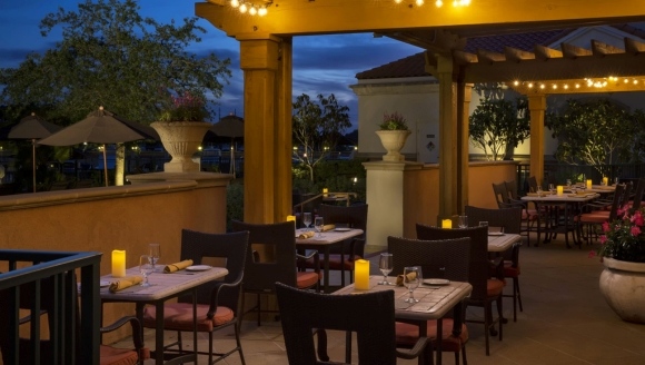 Nighttime view of a beautifully lit patio at Waterscapes Dining, Honeymoon Rooms, Myrtle Beach SC.