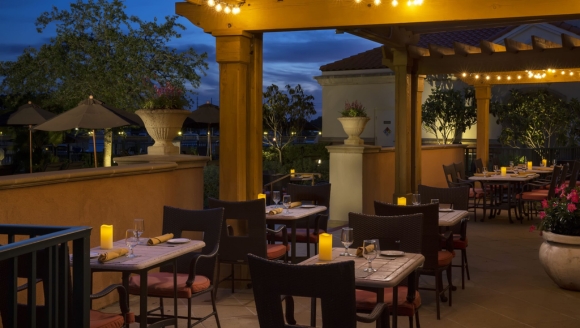 Nighttime view of a beautifully lit patio at Waterscapes Dining, Honeymoon Rooms, Myrtle Beach SC.