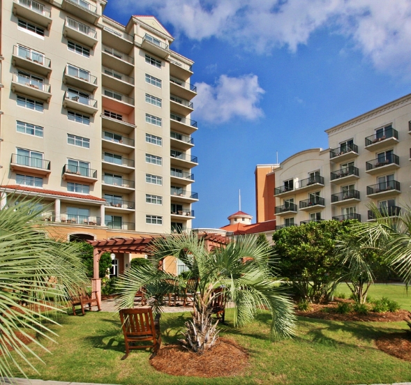 A scenic view of a beach resort in Myrtle Beach, SC, promoting anniversary packages for couples.