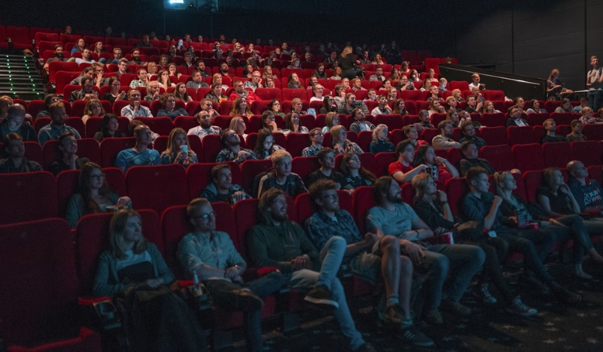Attendees watching a film in a cinema hall, part of Myrtle Beach's Autism Friendly sensory-friendly movie night.