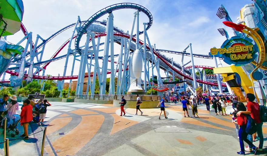 A thrilling roller coaster at Family Kingdom Amusement Park in Myrtle Beach, surrounded by excited riders and vibrant attractions.