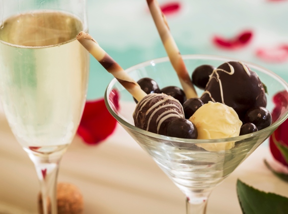 A luxurious martini glass showcasing chocolate and champagne, perfect for Myrtle Beach anniversary celebrations.