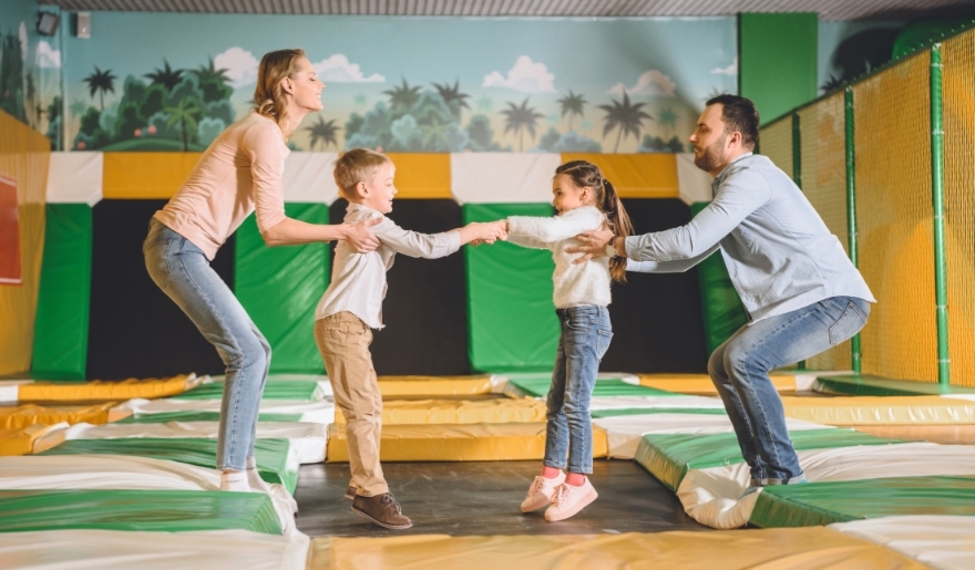 Joyful family enjoying trampoline fun at Big Air Trampoline Park, Myrtle Beach, creating lasting vacation memories.