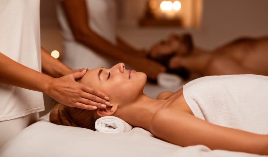 A couple enjoys a relaxing massage at a spa in Myrtle Beach, promoting tranquility and wellness at Marina Inn.