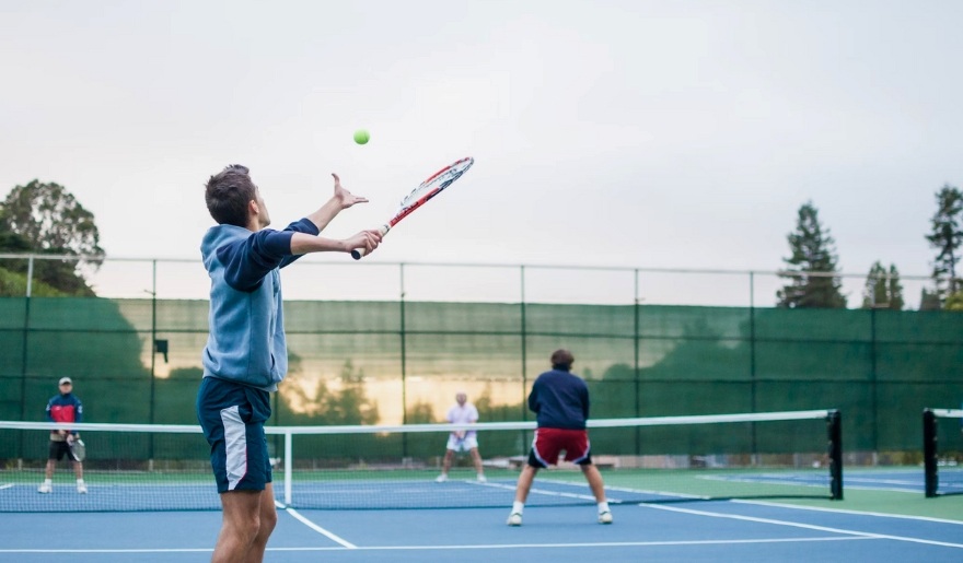 Players on a tennis court at Grande Dunes Tennis Club in Myrtle Beach, showcasing an October day of competitive play.