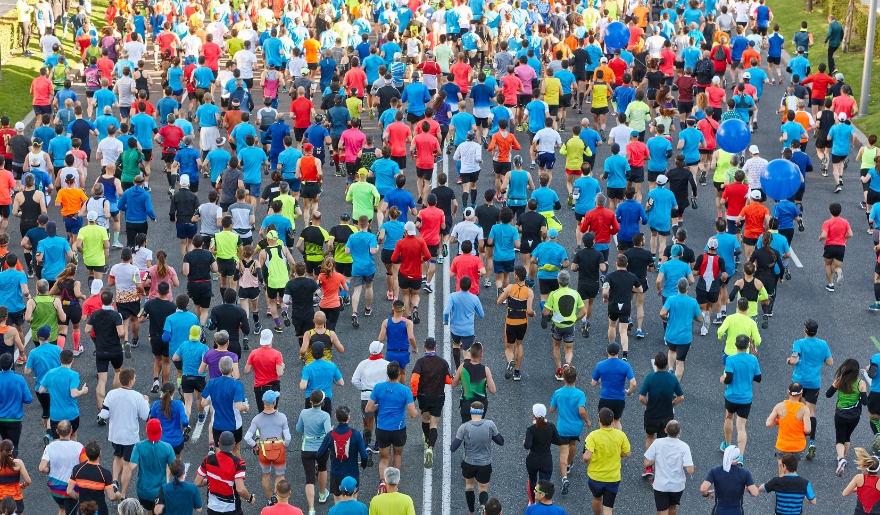A diverse crowd of runners in the Myrtle Beach Christmas 5K, showcasing community spirit during the holiday season.