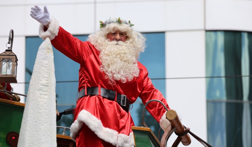 anta Claus greets the crowd from a colorful float in the Myrtle Beach Christmas parade at Broadway at the Beach.