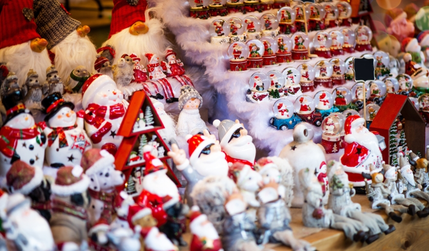 A collection of Santa Claus figurines on display at Myrtle Beach Christmas Santa’s Workshop event.